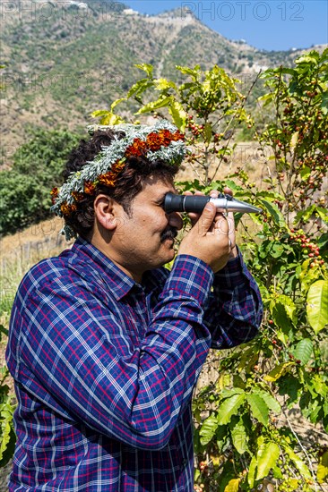 Traditional dressed man of the Qahtani Flower men tribe in the coffee plants