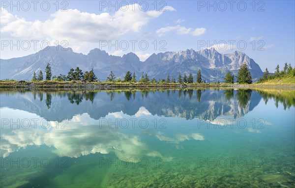 Idyllic Astbergsee with reflection of the mountain panorama