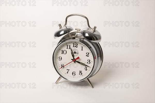 Metal alarm clock with mechanical clockwork and bell mechanism