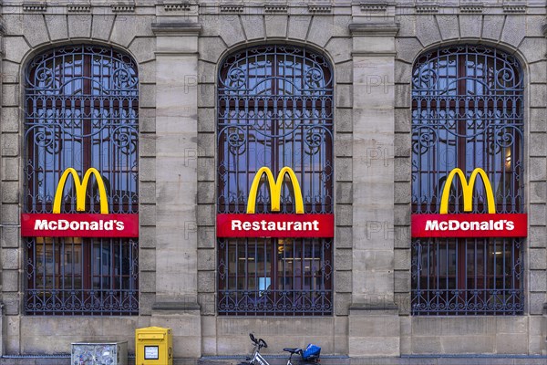 Mc Donald logos on a heritage-protected facade of the former main post office