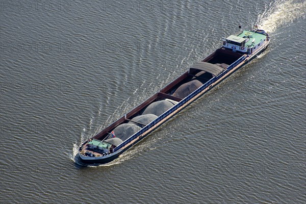 Aerial view of a barge Swabia with bulk material on the Elbe
