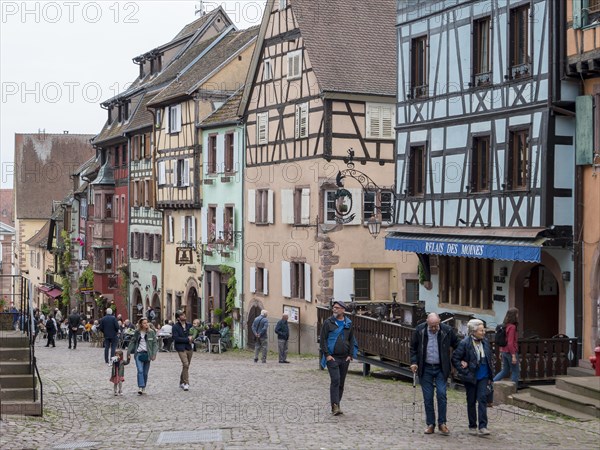 Colourful half-timbered houses with old tower of the historic old town in Rue du General du Gaulle