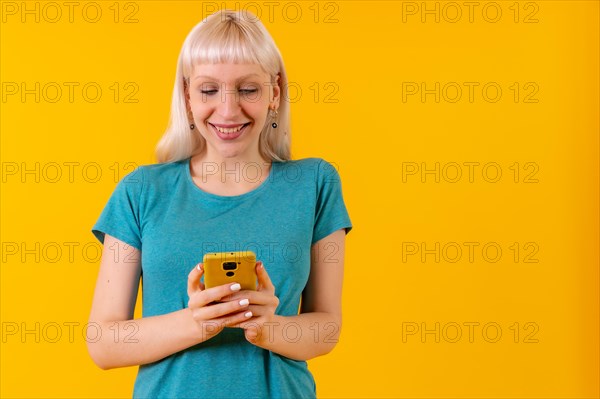 Smiling with phone in hands