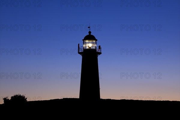 The red and white lighthouse Naers fyr at Naersholmen on the island Gotland