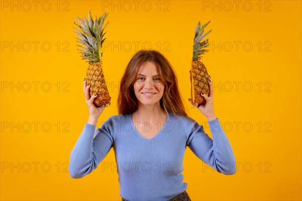 Woman with a pineapple in sunglasses