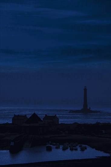Lighthouse and lifeboat station in the Goury port near Auderville at the Cap de La Hague at night