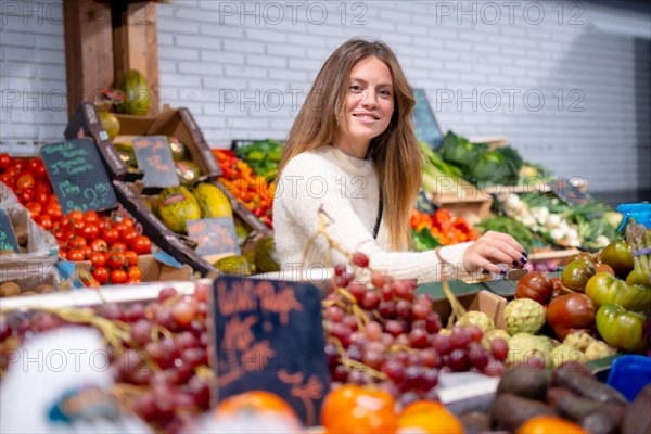 Woman worker of a greengrocer and vegetable food store. healthy and healthy life