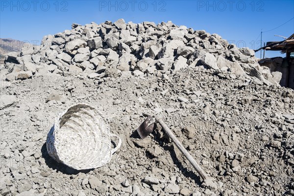 Heap of clay and equipment used in pottery factory in Fez