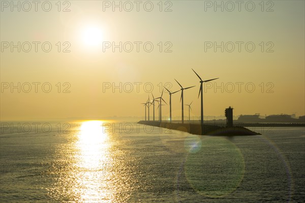 Wind turbines at windfarm on dam in the Zeebrugge