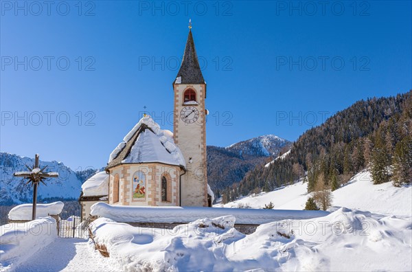 Snow-covered church in the Fanes Sennes Braies nature park Park