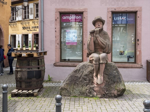 Sculpture of a boy with a flute