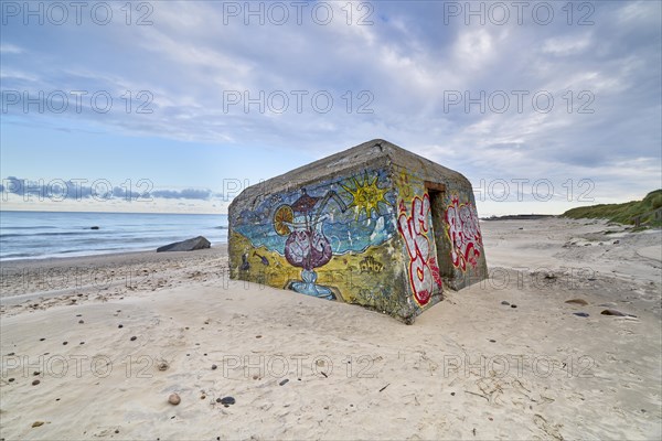 Beautiful white sandy beach with a bunker