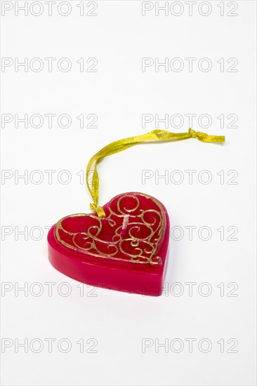 Red candle in heart shape with pendant