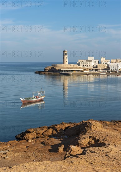 Fishing boat and Al-Ayjah Lighthouse