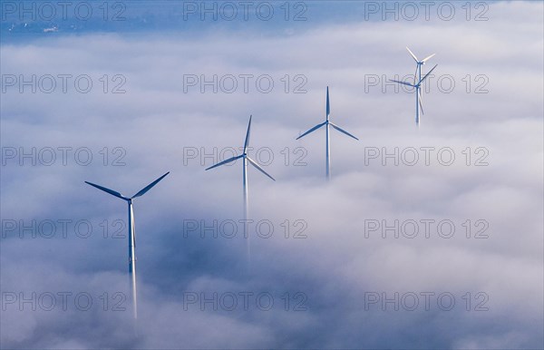 Wind power station in the fog