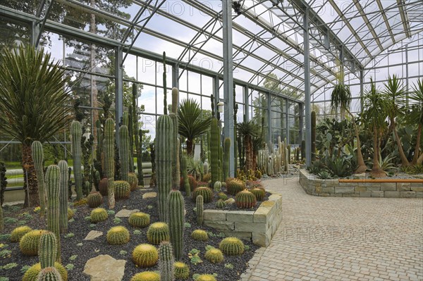 Glass plant house in the villa gardens by the lake