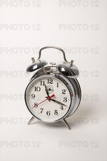 Metal alarm clock with mechanical clockwork and bell mechanism