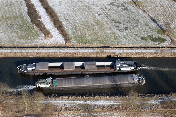 Aerial view of two barges in the Elbe Luebeck Canal in winter