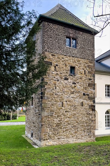 Historic tower with historic building fabric from 14th-15th century of outer castle of moated castle Schloss Borbeck