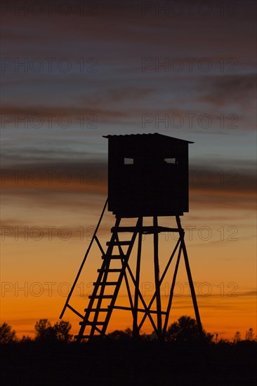 Raised hide in meadow