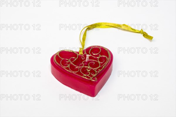 Red candle in heart shape with pendant