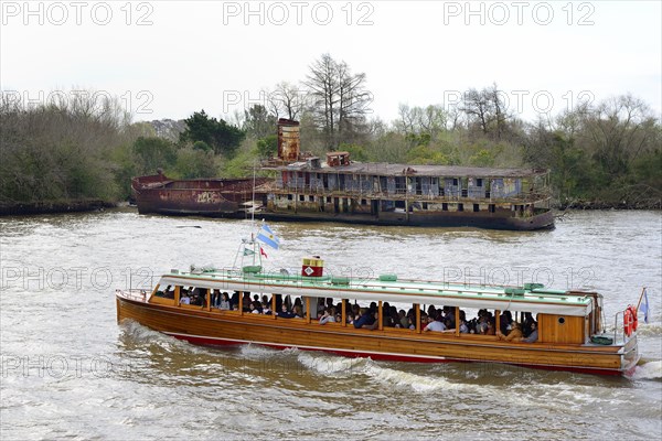 Excursion boat and shipwreck on the Rio Lujan