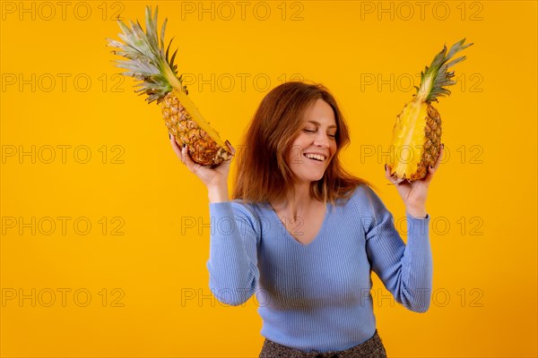 Woman with a pineapple in sunglasses