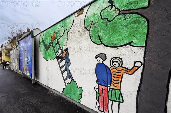 Childlike painting on decaying wall