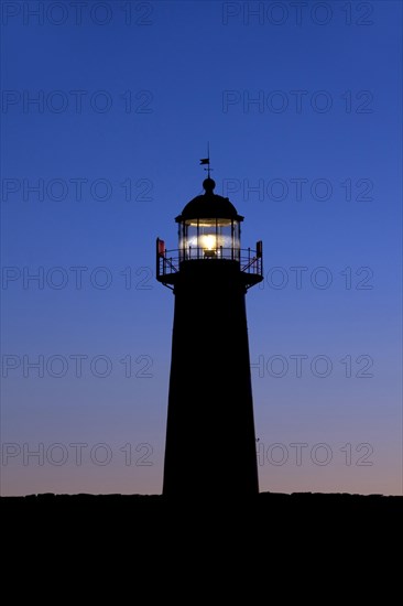 The red and white lighthouse Naers fyr at Naersholmen on the island Gotland