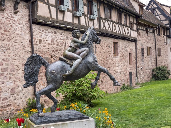 Sculpture of a rider on Joseph's horse "La Dame du Parc" in front of the town wall