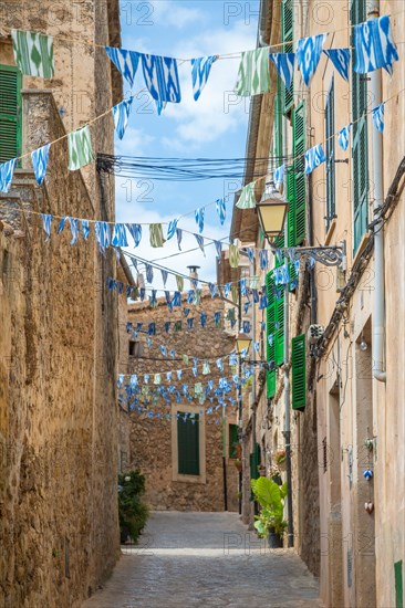 Narrow alley with flags