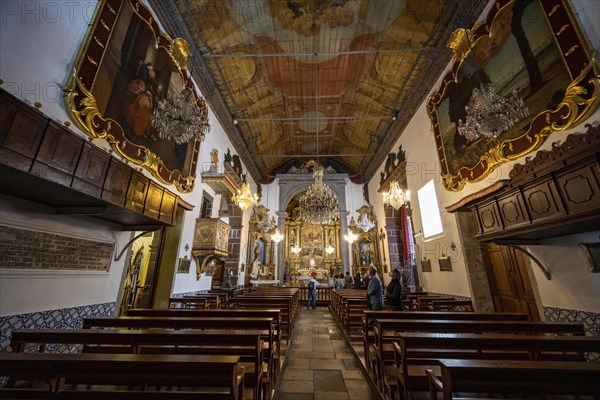 Interior with pews and ceiling painting