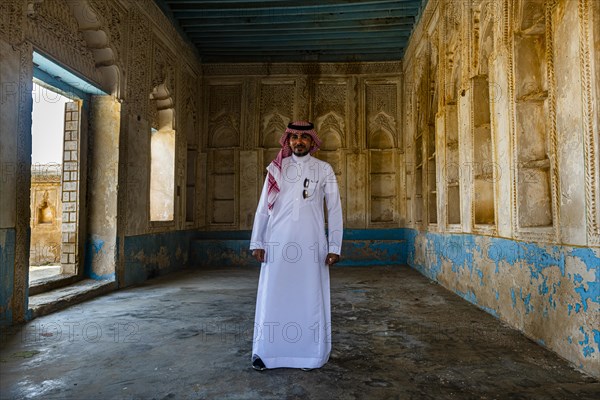 Man standing in a beautiful old merchant house