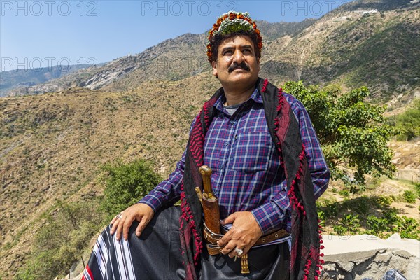 Traditional dressed man of the Qahtani Flower men tribe in the coffee plants