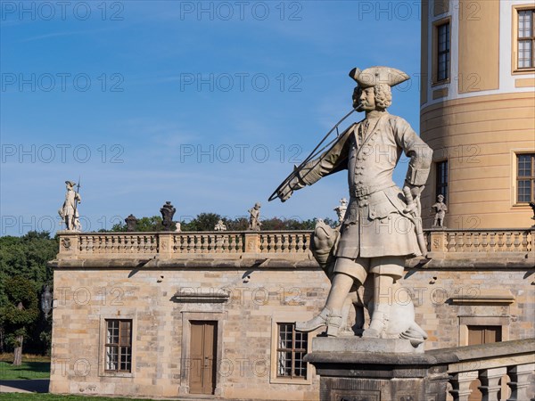 Sculpture of a uniformed hunting assistant in the Moritzburg Hunting and Baroque Palace in the middle of Schlossteich See