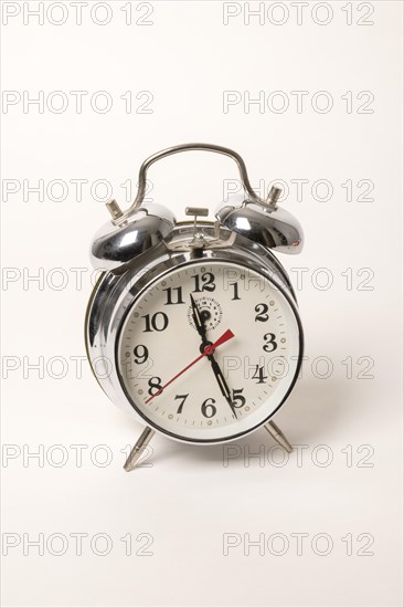 Metal alarm clock with mechanical clockwork and bell mechanism