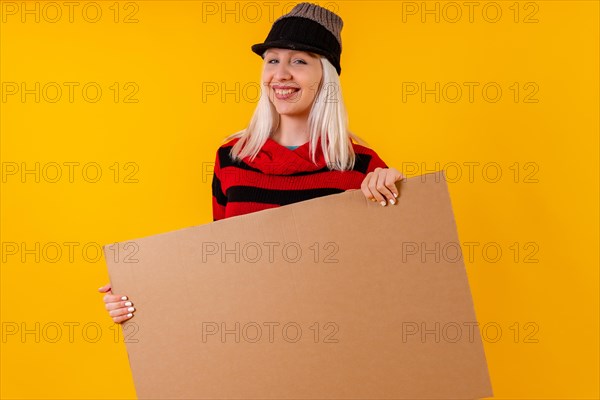 Holding empty cardboard advertisement poster