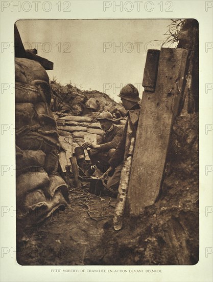 Soldier loading trench mortar with bomb at Diksmuide in Flanders during the First World War