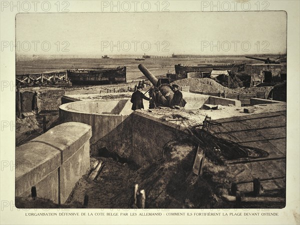 Soldiers with cannon at German fortification and bunkers on the beach at Ostend in Flanders during the First World War
