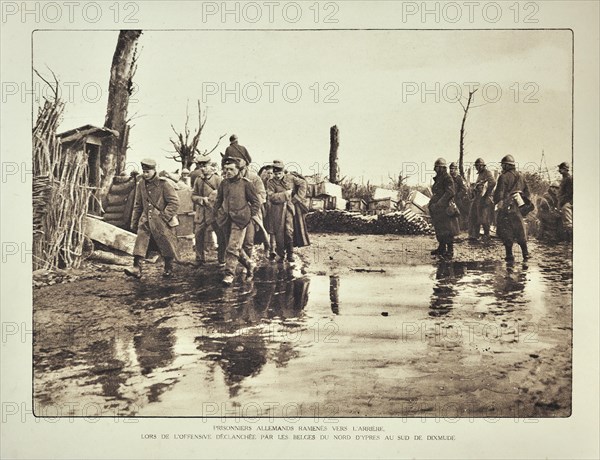 Convoy with German prisoners marching from Ypres to Diksmuide in Flanders during the First World War