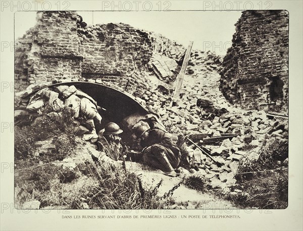 Soldier using telephone at observation post in ruin in Flanders during the First World War