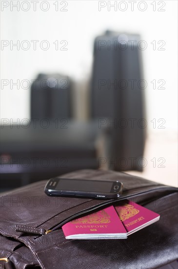 Passports sticking out of a travel bag