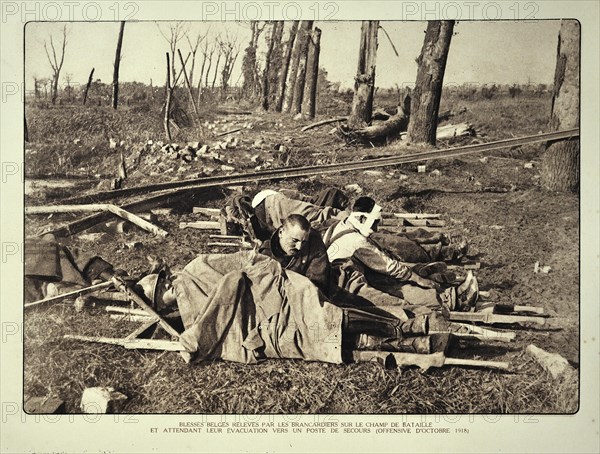 Wounded soldiers on stretchers waiting for evacuation from the battlefield in Flanders during the First World War