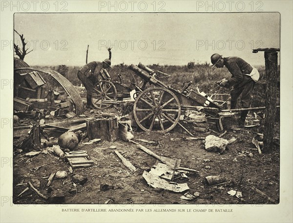 Soldiers and abandoned German artillery battery