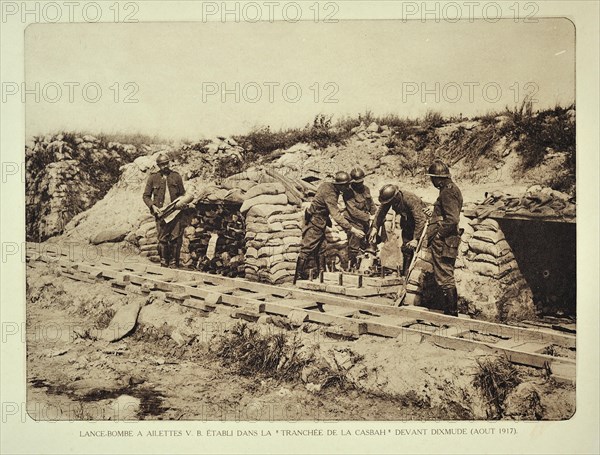 Soldiers loading trench mortar with bomb at Diksmuide in Flanders during the First World War