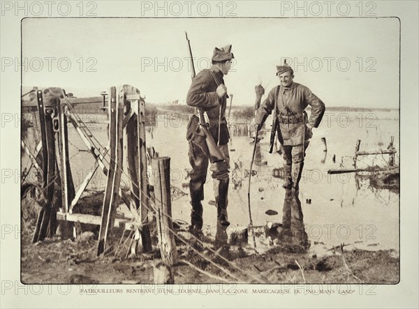 Soldier returning from reconnaissance patrol in flooded terrain in Flanders during the First World War