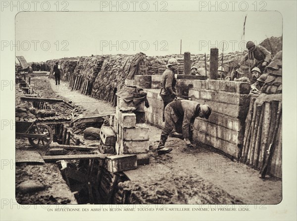Soldiers repairing bombed shelter in trench at battlefield in Flanders during the First World War
