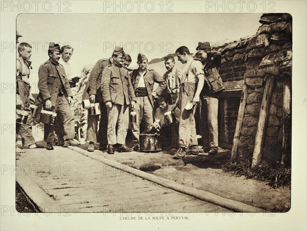 Soldiers eating soup at field kitchen in trench at Pervijze in Flanders during the First World War