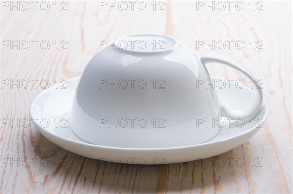 Cup upside down on a saucer