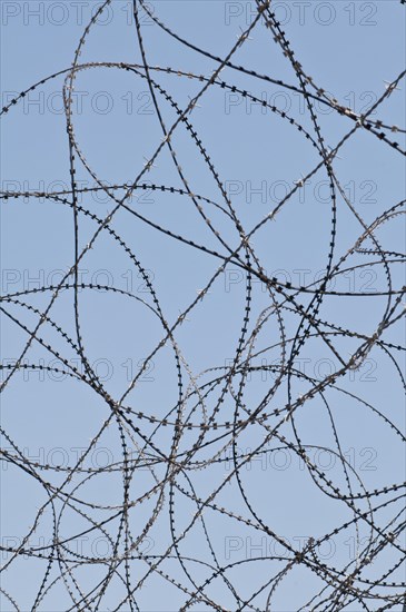 Razor wire on top of the DMZ